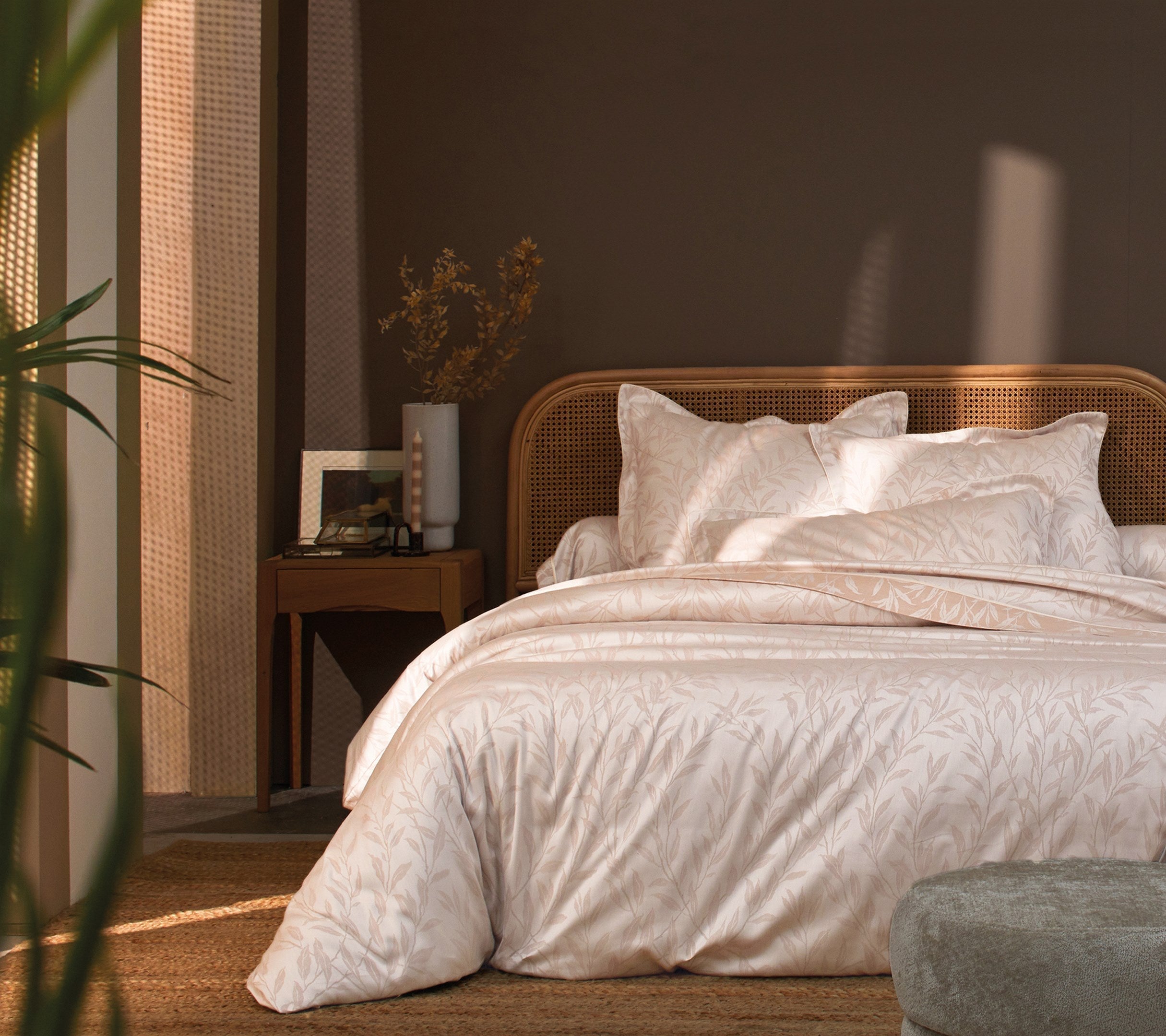 Premium luxury home linens including bed sheets and duvet covers in elegant neutral tones