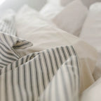 Ticking Stripe Duvet Cover styled with pillows – breathable percale bedding