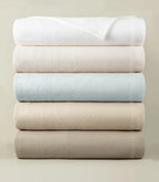 Montauk Matelassé Coverlet all colorways stacked – luxury bedding – Peacock Alley