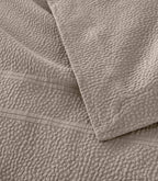 Montauk Matelassé Coverlet corner detail in Gray – pebble texture – Peacock Alley