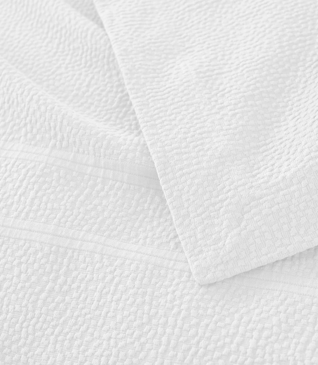 Montauk Matelassé Coverlet corner detail in Pearl – matelassé weave – Peacock Alley