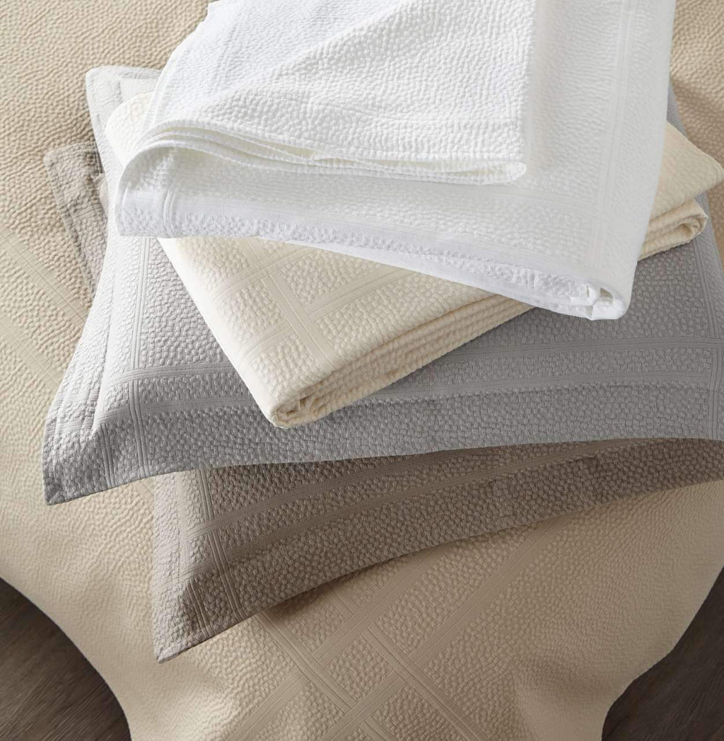 Montauk Matelassé Coverlet folded stack – 100% long-staple cotton – Peacock Alley