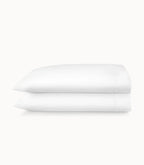 Stack of white folded towels on a white background