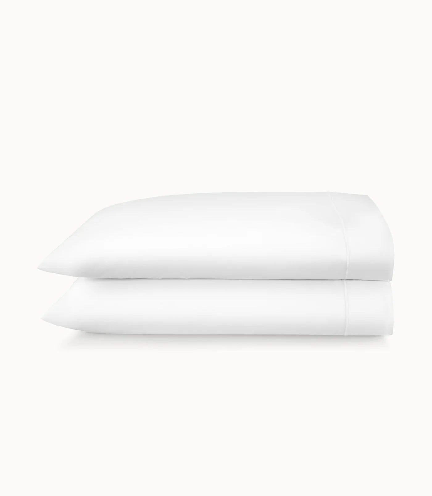 Stack of white folded towels on a white background